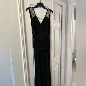 Black stretch material pants suit with shoulder embellishments